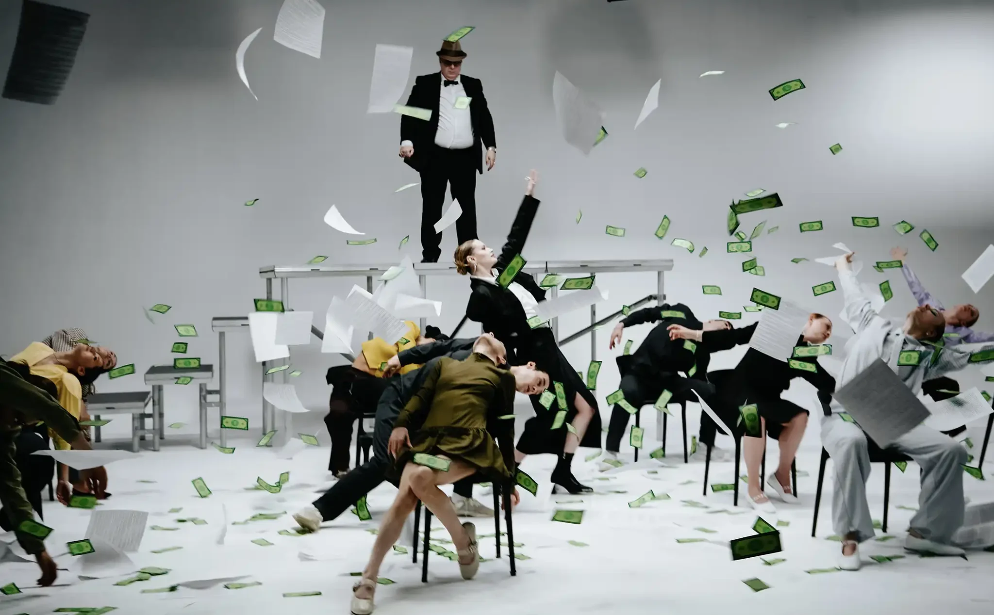 Katia Pojidaeva performing as money and paper fall around her and the cast